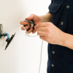 Electrical and Plumbing Services in Lucknow 7 close up hands young man hands repairing broken switch doing home renovations