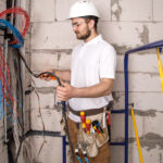 Electrical and Plumbing Services in Lucknow 8 electrician working near board with wires installation connection electrics