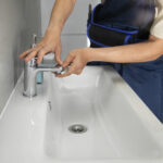 male plumber working fix problems client s house