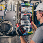 Electrical and Plumbing Services in Lucknow 6 man electrical technician working switchboard with fuses