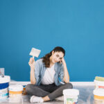 paint concept with sitting woman buckets